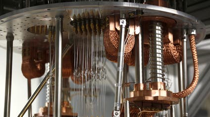 This Feb. 27, 2018, photo shows electronics for use in a quantum computer in the quantum computing lab at the IBM Thomas J. Watson Research Center in Yorktown Heights, N.Y. Describing the inner workings of a quantum computer isn’t easy, even for top scholars. That’s because the machines process information at the scale of elementary particles such as electrons and photons, where different laws of physics apply.