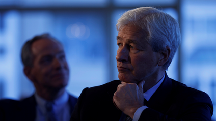 JP Morgan CEO Jamie Dimon listens as he is introduced at the Boston College Chief Executives Club luncheon in Boston.