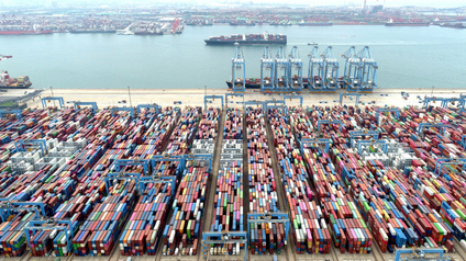 Containers and cargo vessels at the Qingdao port in China