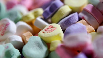 Close up of candy hearts in pastel colors
