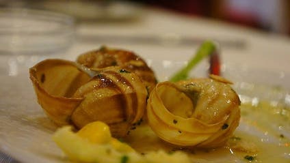 Escargot (snails) on a dining plate