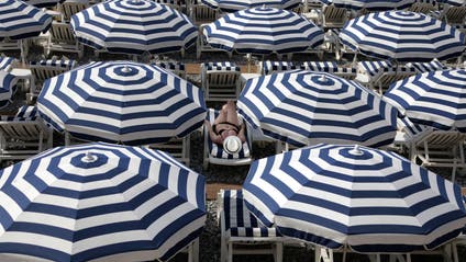 Striped beach umbrellas in Nice, France