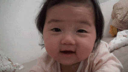 An animated gif of a baby lying down on its side.