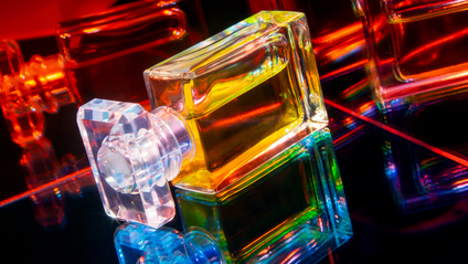 a perfume bottle with refracted light through it