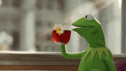 An animated gif of Kermit the frog sipping on a clear mug of Lipton tea.