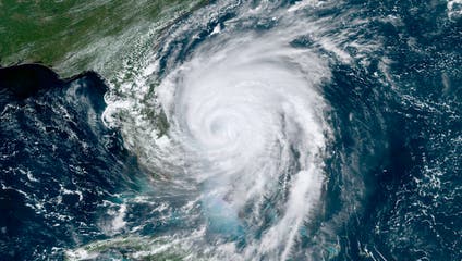 A satellite photo of a hurricane over the state of Florida.