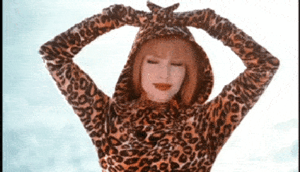 A gif mashup of various artists wearing leopard print in their music videos.