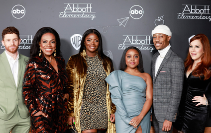 US actors (L-R) Chris Perfetti, Sheryl Lee Ralph, Janelle James, Quinta Brunson, Tyler James Williams and Lisa Ann Walter stand in front of a backdrop that reads "Abbott Elementary."