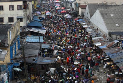 Shoppers crowd at a market place, as Nigerias Lagos state eases a round-the-clock curfew imposed in response to protests against alleged police brutality, after days of unrest, in Lagos, Nigeria October 24, 2020.