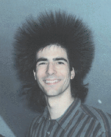A 22-year-old Lou Montulli rocks a big shock of hair that sticks straight up all around his head.