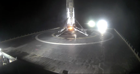 The recovered Falcon 9 rocket stage rests on a sea-going drone landing platform.