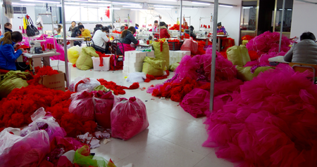 Women from nearby villages sew dance costumes in one of Daiji&#039;s new industrial parks built by the local government to house Taobao businesses.