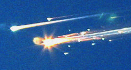 ** FILE **Debris from the space shuttle Columbia streaks across the sky over Tyler, Texas, in this Saturday, Feb. 1, 2003 file photo. Pices of the shuttle were scattered over East Texas with some debris falling in downtown Nacogdoches, Texas. Columbia disintegrated 39 miles over Texas as it returned from a 16-day mission five years ago this Friday, Feb. 1, 2008.