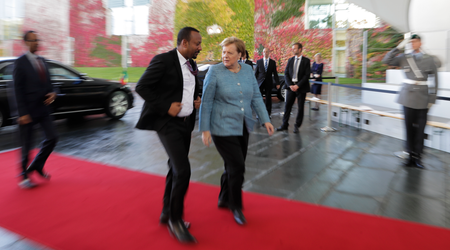 German Chancellor Angela Merkel, center right, welcomes the Prime Minister of Ethiopia Abiy Ahmed Ali, center left, for a meeting at the chancellery in Berlin, Germany, Tuesday, Oct. 30, 2018.