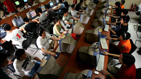 Chinese youth use computers at an Internet cafe in Beijing Saturday June 18, 2005. China has the world&#039;s second-largest online population - 100 million - after the United States, but addiction to the Internet is increasing. The country&#039;s first government-approved clinic geared toward curing Internet addicts, has treated more than 300 addicts since opening last October. (AP Photo/Greg Baker)