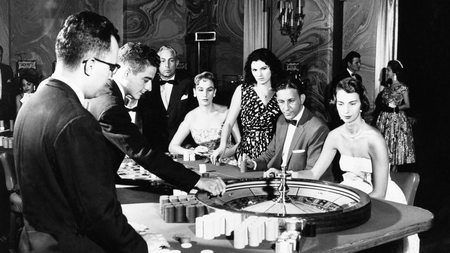 Roulette is one of the many gambling attractions for U.S. tourists in Havana. This Photo Shows a group of players as they watch the spin of the wheel in the International Casino at the Hotel Nacional de Cuba, September 23, 1958.