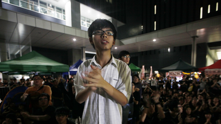 Convener of the students group &quot;Scholarism&quot; Joshua Wong attends a sit-in protest outside the government headquarters in Hong Kong, Wednesday, Sept. 5, 2012. Protesters urged the government to cancel new additional course, &quot;Moral and National Education&quot; subject, to be introduced for school curriculum, starting from a new school year. (AP Photo/Kin Cheung
