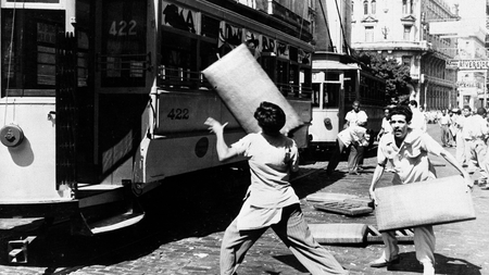 Students throw car seats back into a street car during a demonstration in Havana, Cuba, Feb. 10, 1948. The demonstrators were sympathizing with Guantanamo, Cuba students who are on a hunger strike for a new school building.
