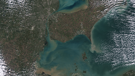 Sediments swirl in Lake Erie and Lake St. Clair in this Landsat 9 image of both Detroit, Michigan, and Windsor, Ontario, from Oct. 31, 2021.