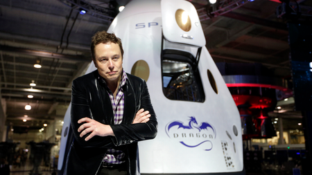 In this Thursday, May 29, 2014 file photo, Elon Musk, CEO and CTO of SpaceX, listens to a question during a news conference in front of the SpaceX Dragon V2 spacecraft, designed to ferry astronauts to low-Earth orbit, at the headquarters in Hawthorne, Calif. The capsule was named for &quot;Puff the Magic Dragon,&quot; a jab at those who scoffed when Musk founded the company in 2002 and set the space bar exceedingly high. SpaceX went on to become the first private company to launch a spacecraft into orbit and return it safely to Earth in 2010.