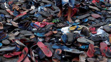 Footwear of migrant protesters chased away by Mumbai Police.