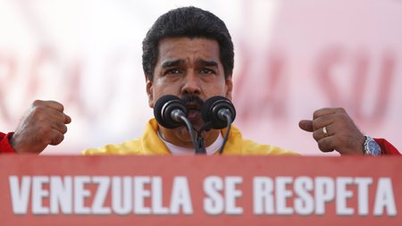 Venezuela&#039;s President Nicolas Maduro speaks during a rally to reject the sanctions that the U.S. government seeks to impose to officials accused of human rights violations, in Caracas December 15, 2014. The words on the podium read, &quot;Respect Venezuela&quot;.