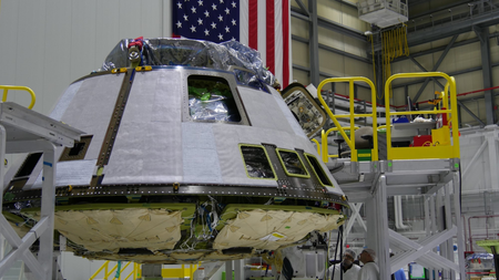 A Boeing CST-100 Starliner spacecraft under construction at Kennedy Space Center.