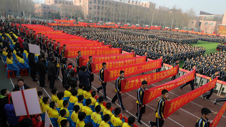 Students take part in an oath-taking rally, 100 days before the annual national college entrance examination, or gaokao, in a high school in Hengshui, Hebei province, China, February 26, 2018.