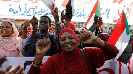 Sudanese demonstrators chant slogans and wave Sudanese flags as they protest in front of the Defence Ministry in Khartoum, Sudan April 17, 2019.