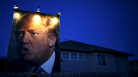 A picture of Trump hangs outside a house in West Des Moines, Iowa.