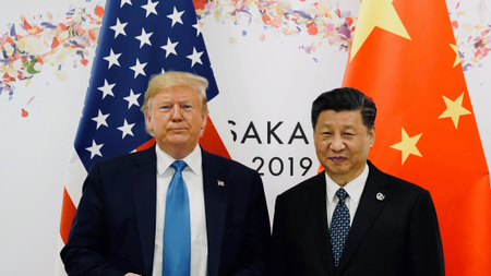 US president Donald Trump standing alongside Chinese president Xi Jinping.