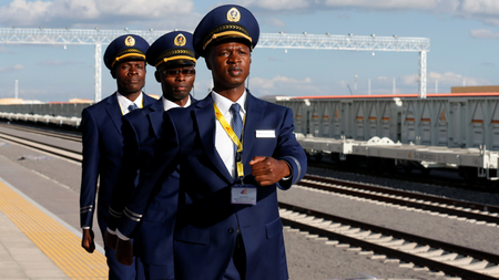 Kenya Railways attendants prepare to receive a train launched to operate on the Standard Gauge Railway (SGR) line constructed by the China Road and Bridge Corporation (CRBC) and financed by Chinese government at the Nairobi Terminus in the outskirts of Kenya&#039;s capital Nairobi May 31, 2017.