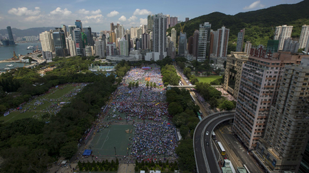Thousands of pro-Beijing protesters gather to march in the streets to demonstrate against a pro-democracy Occupy Central campaign in Hong Kong August 17, 2014.