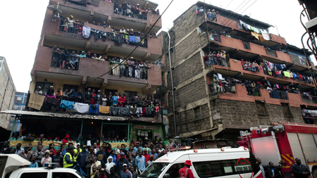 Residents in Nairobi watch rescue efforts at the site of a building collapse on April 30th.
