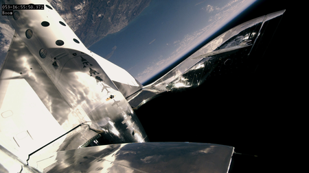 A view from the spaceplane&#039;s tail boom as it begins its return to earth.
