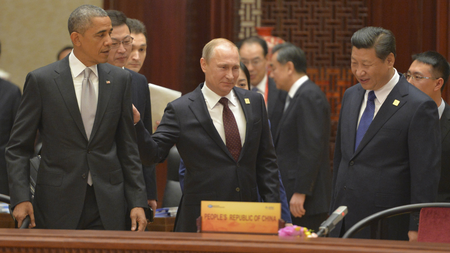 U.S. President Barack Obama, Russian President Vladimir Putin and Chinese President Xi Jinping attend a plenary session during the Asia Pacific Economic Cooperation (APEC) Summit in Beijing, November 11, 2014.