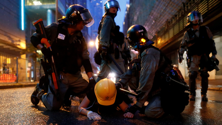 Riot police detain a demonstrator during a protest in Tsuen Wan, in Hong Kong, China August 25, 2019.