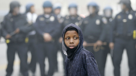 Police move protesters Baltimore on April 27, following the funeral of Freddie Gray.