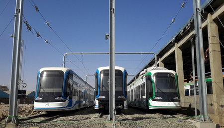 In this photo taken Sunday, March 8, 2015, three trams that were recently brought to Ethiopia from China sit parked at the main hub for the Addis Ababa Light Rail Transit project, aimed at eliminating the lack of public transportation options, during a visit for media to the site in the capital Addis Ababa, Ethiopia. Ethiopia, once known for epic famines that sparked global appeals for help, has a booming economy and big plans these days, with several muscular, forward-looking infrastructure projects undertaken by the government that have fueled talk of this East African country as a rising African giant. (AP Photo)