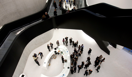 Guests walk inside Maxxi museum of contemporary art and architecture in Rome