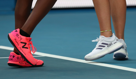 Tennis players Coco Gauff, left, and compatriot Caty McNally wear a tribute to Kobe Bryant on their shoes.