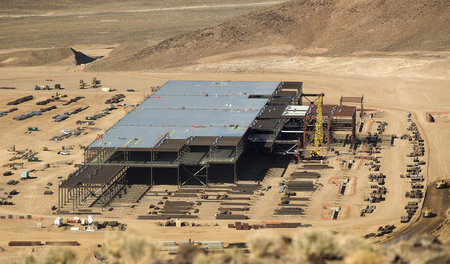 Construction of the Tesla Gigafactory outside Reno, Nevada is shown February 18, 2015. Once known primarily for its casinos and quickie divorces, the Reno area has made impressive strides in its attempt to transform itself into a technology hub in the high-desert of Nevada. In the last few years, it has attracted big Silicon Valley names, including Tesla, Apple and Amazon. But now a new challenge has arisen for Reno: managing its success. Even as the region celebrates its economic wins, it is struggling to cope with the additional demands that the new businesses -- and the new residents they draw -- will place on Reno?s infrastructure, schools, and city services. To match Insight USA-RENO/TECH Picture taken February 18, 2015. REUTERS/James Glover II (UNITED STATES - Tags: TRANSPORT BUSINESS SOCIETY) - RTR4R9LW