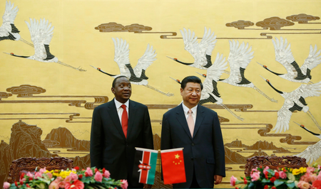 Kenyan President Uhuru Kenyatta (L ) and his Chinese counterpart Xi Jinping stand together during a signing ceremony at the Great Hall of the People in Beijing in 2013.