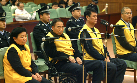 Tian Wenhua, left, and three other former executives of the Sanlu Group at their trial in Hebei province in December 2008.