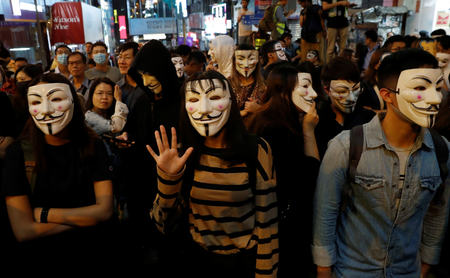 Anti-government protesters wearing costumes march during Halloween in Lan Kwai Fong, in Hong Kongss Central district on Oct. 31.