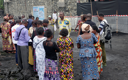 Congolese residents gather around Medecins Sans Frontieres (MSF) health workers as they prepare the introduction of the second ebola vaccine in the DRC in 2019.