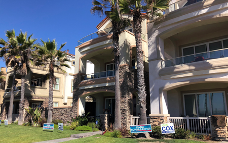 Beachfront homes host signs backing Rohrabacher.