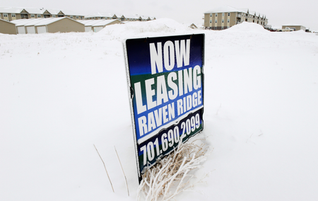 A sign advertises apartments for rent in Dickinson, North Dakota January 21, 2016. Low oil prices have forced rents down across North Dakota&#039;s Bakken oil field, as many workers have lost their jobs or left the industry. The collapse of U.S. oil and gas investment could have further to fall and Americans are showing signs they spend less of their windfall from lower gasoline prices than in the past, darkening the outlook for the U.S. economy.