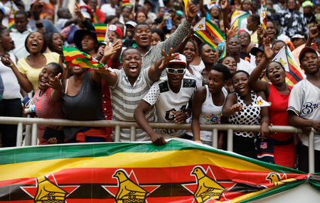 Spectators cheer from the stands at the inauguration ceremony of President Emmerson Mnangagwa in the capital Harare, Zimbabwe Friday, Nov. 24, 2017. Mnangagwa was sworn in as Zimbabwe&#039;s president after Robert Mugabe resigned on Tuesday, ending his 37-year rule.