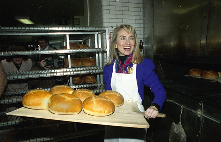Hillary Rodham Clinton, wife of Democratic presidential hopeful BIll Clinton, removes several loaves of fresh bread from the oven of Panetteria Bakery in the Bronx borough of New York, April 3, 1992. Mrs. Clinton is campaigning in New York for her husband as the candidates prepare for New York&#039;s primary.